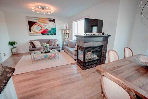 178 Autumn Circle Se, Calgary, AB - Indoor Photo Showing Living Room With Fireplace