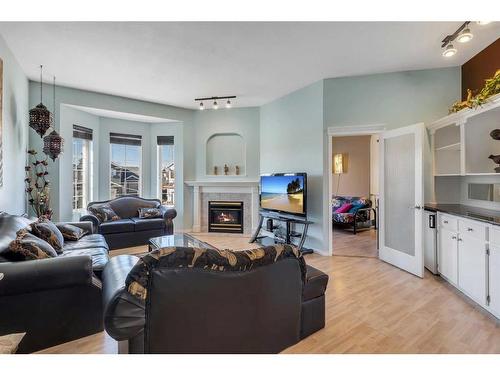 218 Coral Keys Court Ne, Calgary, AB - Indoor Photo Showing Living Room With Fireplace