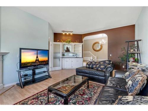 218 Coral Keys Court Ne, Calgary, AB - Indoor Photo Showing Living Room With Fireplace