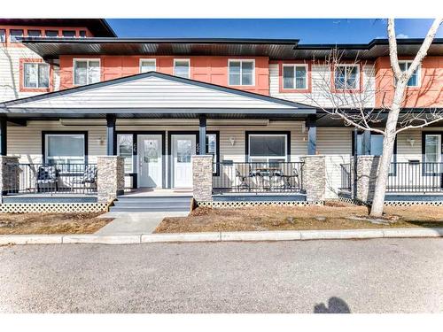 62 Eversyde Common Sw, Calgary, AB - Outdoor With Deck Patio Veranda With Facade