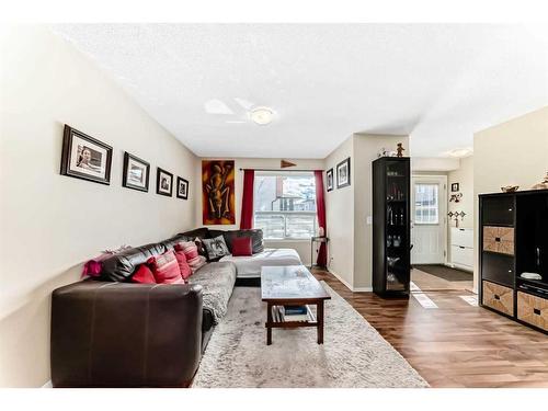 62 Eversyde Common Sw, Calgary, AB - Indoor Photo Showing Living Room