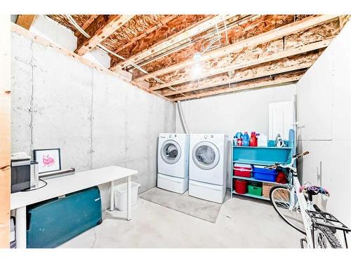 62 Eversyde Common Sw, Calgary, AB - Indoor Photo Showing Laundry Room