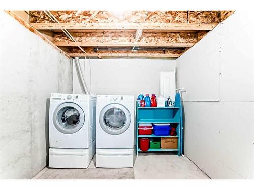 62 Eversyde Common Sw, Calgary, AB - Indoor Photo Showing Laundry Room