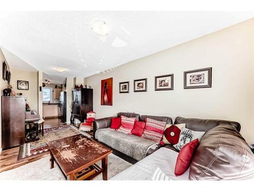 62 Eversyde Common Sw, Calgary, AB - Indoor Photo Showing Living Room