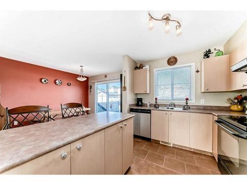 62 Eversyde Common Sw, Calgary, AB - Indoor Photo Showing Kitchen With Double Sink