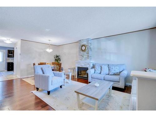 198 Hidden Valley Villas Nw, Calgary, AB - Indoor Photo Showing Living Room With Fireplace