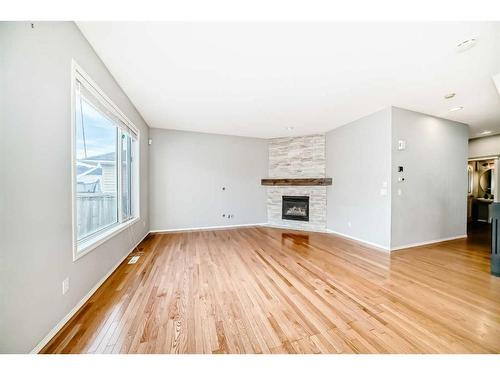 18 Coral Reef Crescent Ne, Calgary, AB - Indoor Photo Showing Living Room With Fireplace