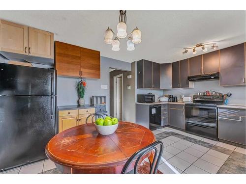 55 Penworth Close Se, Calgary, AB - Indoor Photo Showing Kitchen With Double Sink