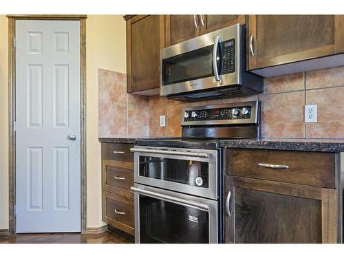 304 New Brighton Place Se, Calgary, AB - Indoor Photo Showing Kitchen With Stainless Steel Kitchen