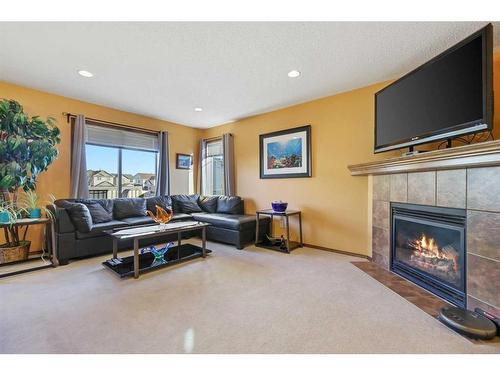 304 New Brighton Place Se, Calgary, AB - Indoor Photo Showing Living Room With Fireplace