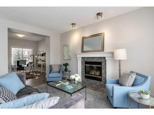 174 Cranfield Green Se, Calgary, AB - Indoor Photo Showing Living Room With Fireplace