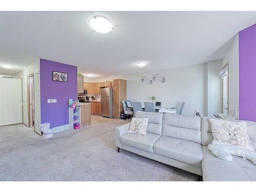 13 Mt Aberdeen Manor Se, Calgary, AB - Indoor Photo Showing Living Room