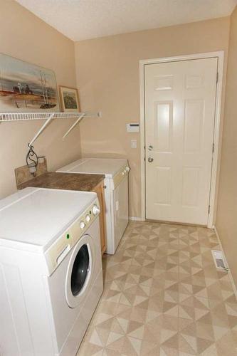 178 Somerglen Way Sw, Calgary, AB - Indoor Photo Showing Laundry Room