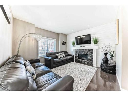 163 Mahogany Grove Se, Calgary, AB - Indoor Photo Showing Living Room With Fireplace