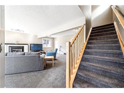 112 Beaconsfield Way Nw, Calgary, AB - Indoor With Fireplace