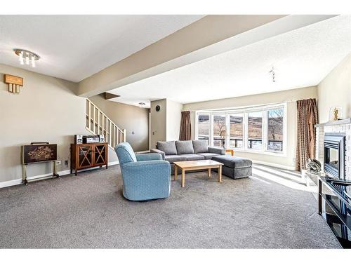 112 Beaconsfield Way Nw, Calgary, AB - Indoor With Fireplace