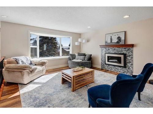 3343 Barrett Place Nw, Calgary, AB - Indoor Photo Showing Living Room With Fireplace