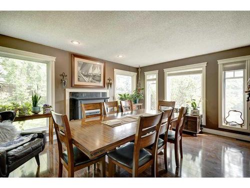 5003 Norris Road Nw, Calgary, AB - Indoor Photo Showing Dining Room With Fireplace