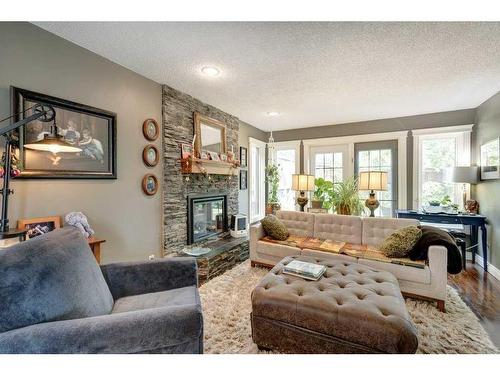 5003 Norris Road Nw, Calgary, AB - Indoor Photo Showing Living Room With Fireplace