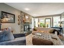 5003 Norris Road Nw, Calgary, AB  - Indoor Photo Showing Living Room With Fireplace 