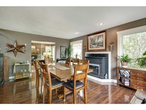 5003 Norris Road Nw, Calgary, AB - Indoor Photo Showing Dining Room With Fireplace