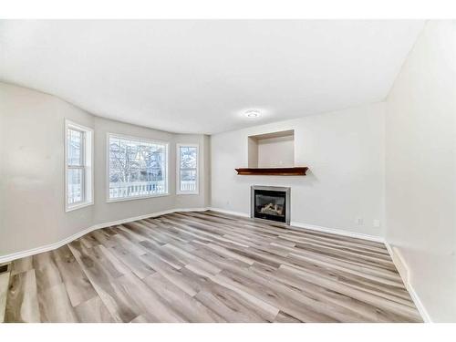 330 Everglen Rise Sw, Calgary, AB - Indoor Photo Showing Living Room With Fireplace