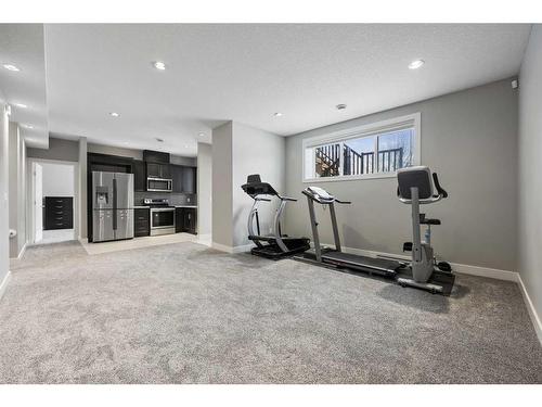 75 Aspen Summit Court Sw, Calgary, AB - Indoor Photo Showing Gym Room