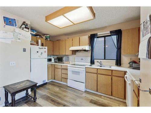 44 Whitworth Way Ne, Calgary, AB - Indoor Photo Showing Kitchen With Double Sink