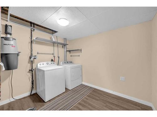 64 Hidden Way Nw, Calgary, AB - Indoor Photo Showing Laundry Room