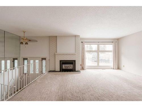 7 Lake Sundance Place Se, Calgary, AB - Indoor Photo Showing Living Room With Fireplace