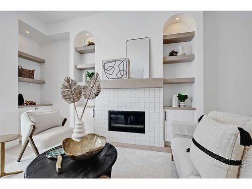 215 25 Avenue Nw, Calgary, AB - Indoor Photo Showing Living Room With Fireplace