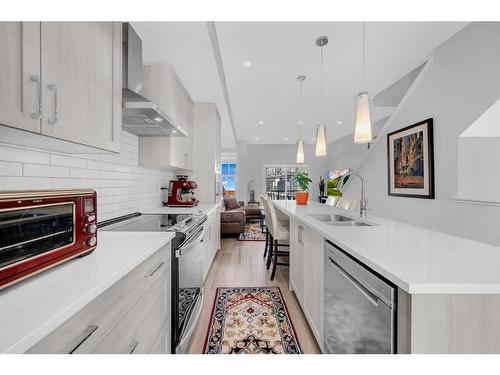 615 Sage Hill Grove Nw, Calgary, AB - Indoor Photo Showing Kitchen With Double Sink With Upgraded Kitchen