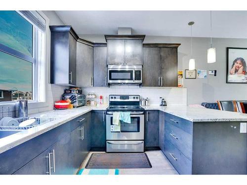 634 Redstone View Ne, Calgary, AB - Indoor Photo Showing Kitchen With Double Sink