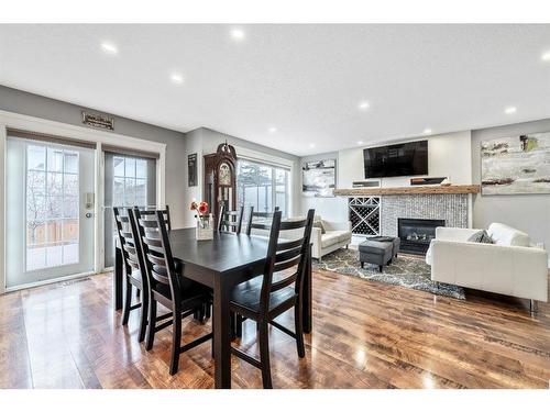 231 Rocky Ridge Close Nw, Calgary, AB - Indoor Photo Showing Dining Room With Fireplace