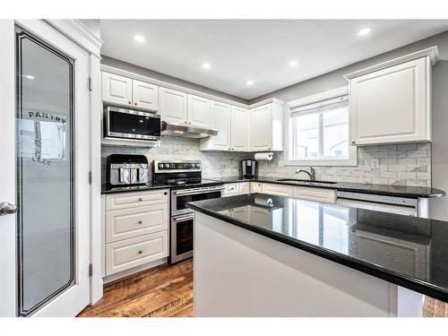 231 Rocky Ridge Close Nw, Calgary, AB - Indoor Photo Showing Kitchen With Upgraded Kitchen