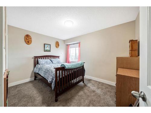 231 Rocky Ridge Close Nw, Calgary, AB - Indoor Photo Showing Bedroom