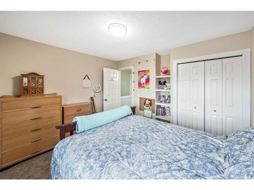 231 Rocky Ridge Close Nw, Calgary, AB - Indoor Photo Showing Bedroom