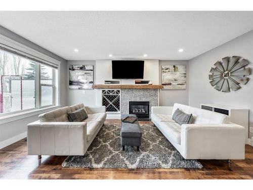 231 Rocky Ridge Close Nw, Calgary, AB - Indoor Photo Showing Living Room With Fireplace