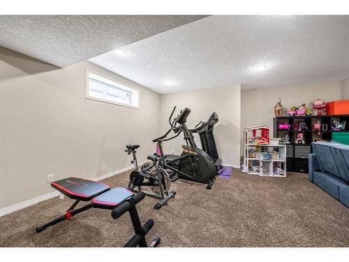 231 Rocky Ridge Close Nw, Calgary, AB - Indoor Photo Showing Gym Room