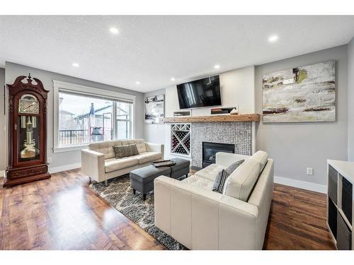 231 Rocky Ridge Close Nw, Calgary, AB - Indoor Photo Showing Living Room With Fireplace