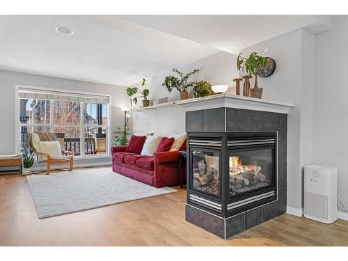 149 New Brighton Green Se, Calgary, AB - Indoor Photo Showing Living Room With Fireplace