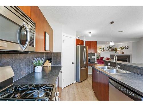 149 New Brighton Green Se, Calgary, AB - Indoor Photo Showing Kitchen With Double Sink