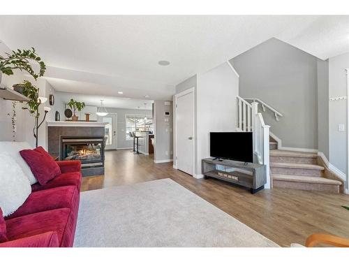 149 New Brighton Green Se, Calgary, AB - Indoor Photo Showing Living Room With Fireplace