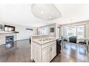 971 Auburn Bay Boulevard Se, Calgary, AB  - Indoor Photo Showing Kitchen With Fireplace With Double Sink 