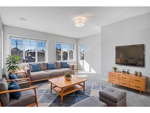 338 Shawnee Boulevard Sw, Calgary, AB - Indoor Photo Showing Living Room