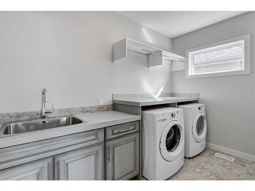 338 Shawnee Boulevard Sw, Calgary, AB - Indoor Photo Showing Laundry Room