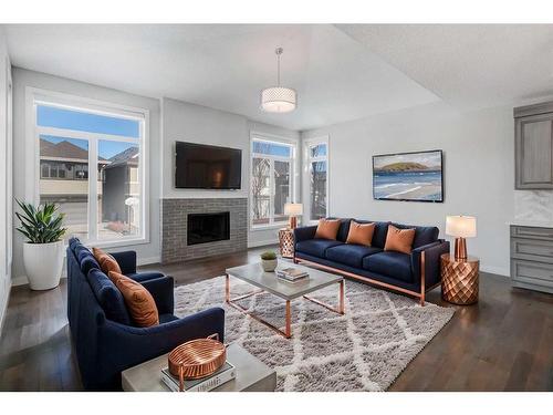 338 Shawnee Boulevard Sw, Calgary, AB - Indoor Photo Showing Living Room With Fireplace