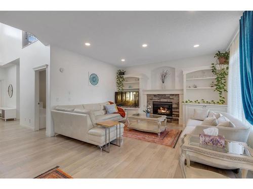 20 Weston Drive Sw, Calgary, AB - Indoor Photo Showing Living Room With Fireplace