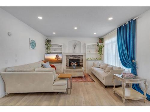 20 Weston Drive Sw, Calgary, AB - Indoor Photo Showing Living Room With Fireplace