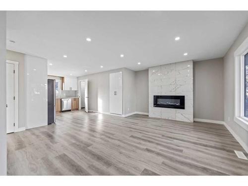 3239 Dovercliffe Road Se, Calgary, AB - Indoor Photo Showing Living Room With Fireplace